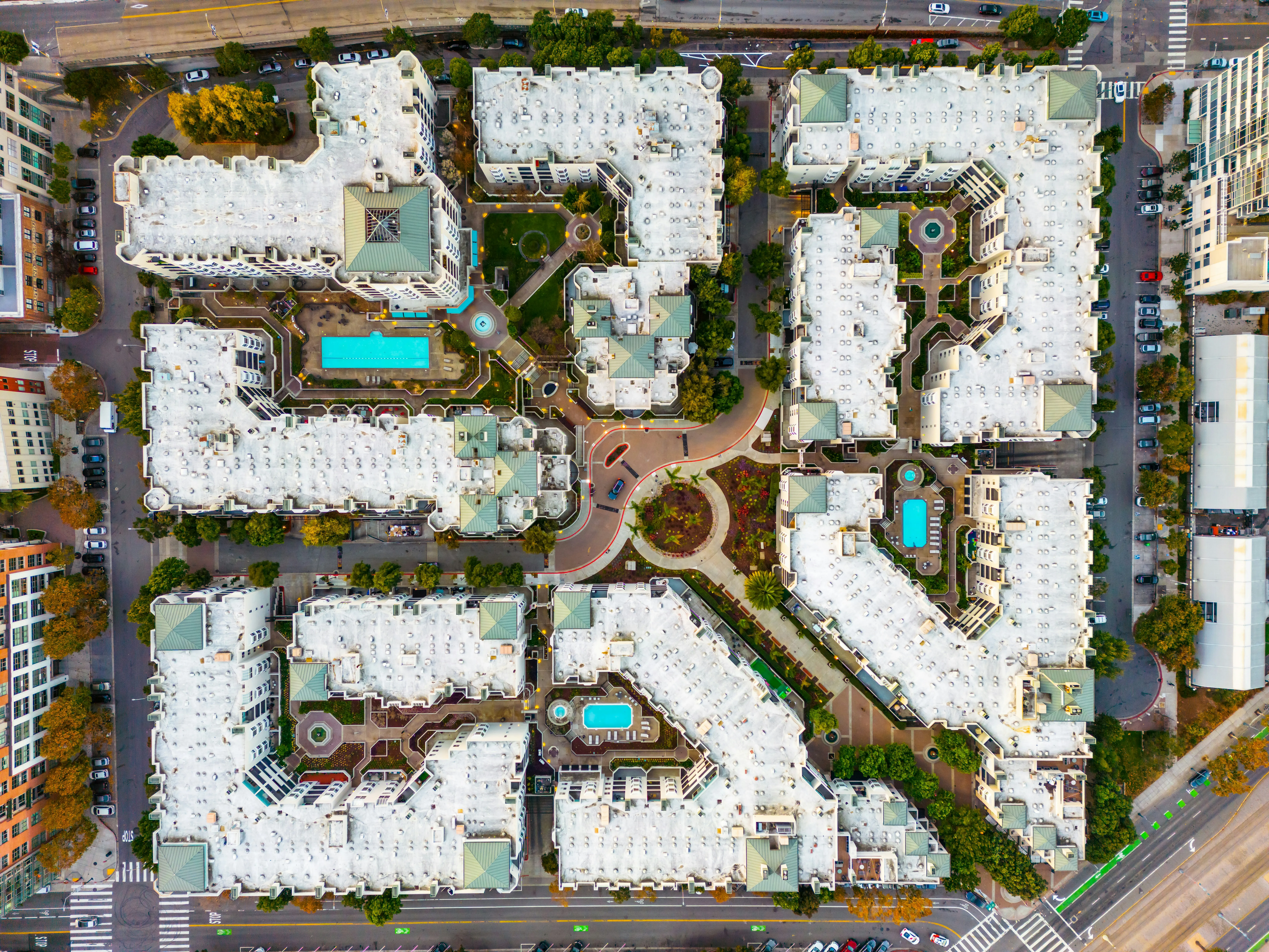 Aerial view of a multi-property hospitality complex with multiple buildings and shared amenities